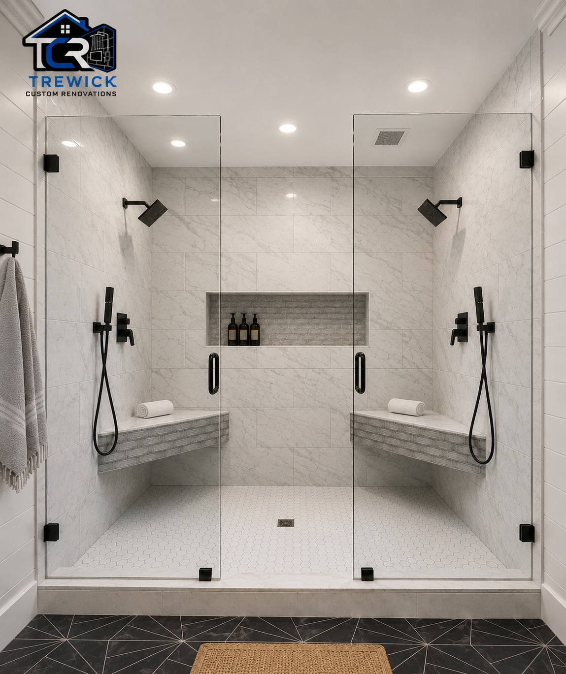 Large walk-in shower with dual fixtures, benches and frameless glass
