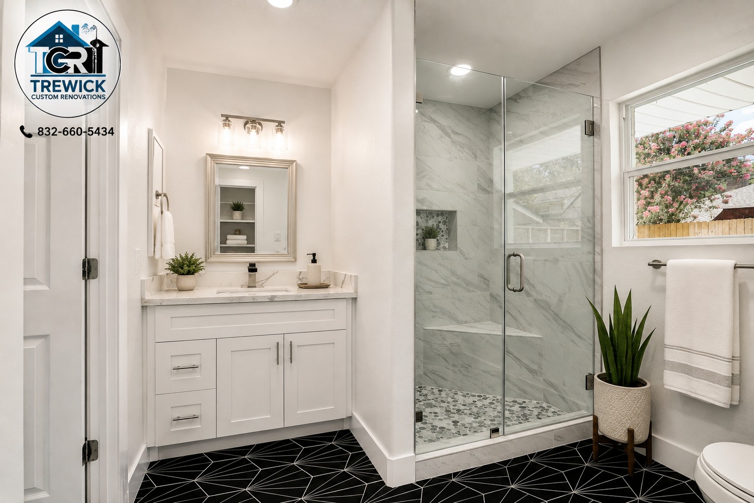 Secondary bathroom remodel with white vanity, frameless shower and black geometric floor